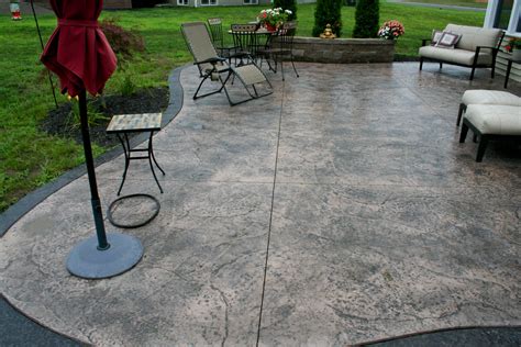 Concrete patio cost - The cost to replace a concrete patio could be $1.00 to $2.60 per square foot more if demolition of an existing patio is required. Concrete patio cost (reinforced concrete) based on the size of your patio: Concrete patio cost (7 ft x 7 ft): $300 to $800. Concrete patio cost (10 ft x 10 ft): $500 to $1,500. Concrete patio cost (12 ft x 14 ft ...